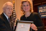 Theresa Werner, National Press Club President, presents Bob Webb with his Vivian Award for 2012, on 8 January 2013.
